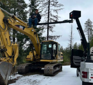 picture of excavator in the snow